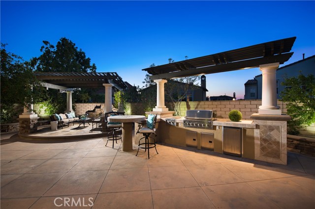 101 Symphony Irvine, California STUNNING Sienna Quail Hill estate home situated high above city with view on premium cul-de-sac lot! Largest Plan 4 offered by Standard Pacific in this coveted upscale community. This residence combines the best of privacy & luxury living. The 4080SF of interior living space encompasses a formal living & dining room, Chef's dream kitchen w/ generous-sized island, stainless steel appliances & 6 burner range stove. Downstairs private indoor courtyard w/ beautiful custom flooring, fireplace, & large interior glass windows for a cozy retreat. Downstairs offers 1 full bedrooms & 1 full bath with a separate executive office with built in custom cabinets, 2 car garage. Upstairs loft area with bar and beautiful french doors leading to over-sized balcony with views of city lights and Irvine Spectrum. Extravagant master bedroom w/ separate retreat currently used as a private gym. Spa-inspired master bath w/ his-and- hers organized closets. 2 generous-sized secondary bedrooms w/ large closets & private balcony. Entertainer's dream over-sized backyard offers the perfect venue for any occasion. Built in BBQ, full bar with stools, pizza oven, and shaded seating area with tranquil waterfall fountain. This premier property is offered in Irvine's idyllic Quail Hill community w/ 5 parks, 3 Olympic-sized pools, Community Summer Swim Team, Upscale Fitness Center. Close to nature trails & beach. Located in award-winning University High School region of the Irvine Unified School District.