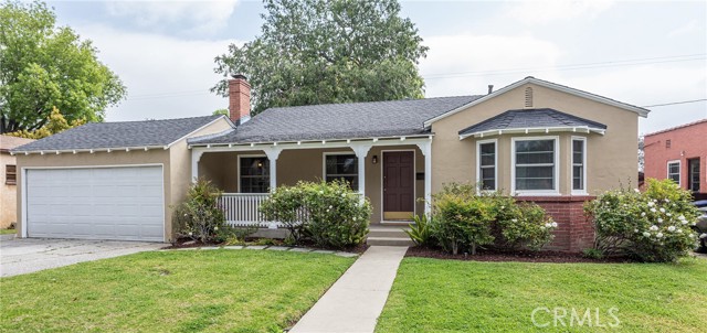 Welcome to your charming home with an abundance of curb appeal on a quiet tree lined street!