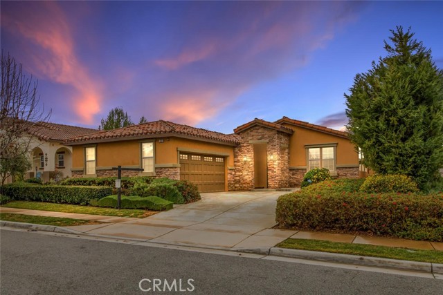 1312 Heritage Drive Calimesa, California Beautiful turnkey home is located within the JP Ranch gated community in Calimesa. Home is a 3 bedroom & 3 bath single story home of approx. 2,307 sq. ft. Features includes raised panel cabinets throughout the home, raised-panel interior doors, 5" baseboards, central vacuum system, cast-iron tubs in secondary bathrooms, laundry room with storage and deep sink, Ceiling fans throughout, Ceramic tile flooring at kitchen, entry, all baths and laundry room, great room design with 42" fireplace. Spacious kitchen has stainless steel appliances, whirlpool professional built-in 30” self-cleaning oven, 36” 5-burner cooktop, dishwasher, microwave, large island with breakfast counter, walk-in pantry, roll-out shelving in kitchen, abundance of cabinetry and has granite countertops, the master suite offers an elegant bath with dual sinks, separate tub, tiled shower and oversized walk-in closet. Insulated garage door, patio cover and fake turf in backyard with amazing views. Low HOA maintains the entry gates, private streets, Clubhouse, Community pool, spa, barbecue area with outdoor dining, half-court basket and tot lot. THIS HOME WILL NOT LAST.