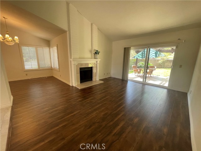 Living room with fireplace and dining room