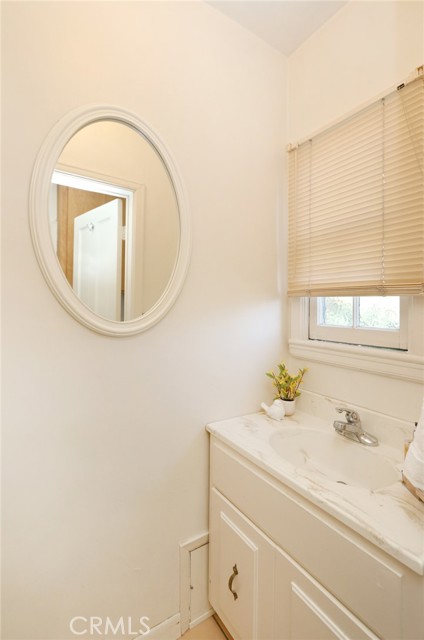 Half bathroom off kitchen and laundry room