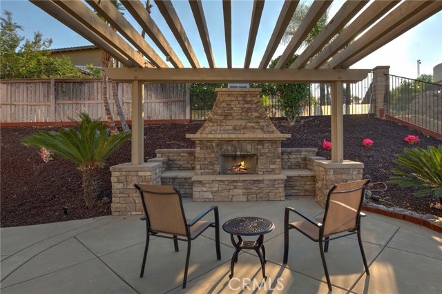 Outdoor seating area with fireplace