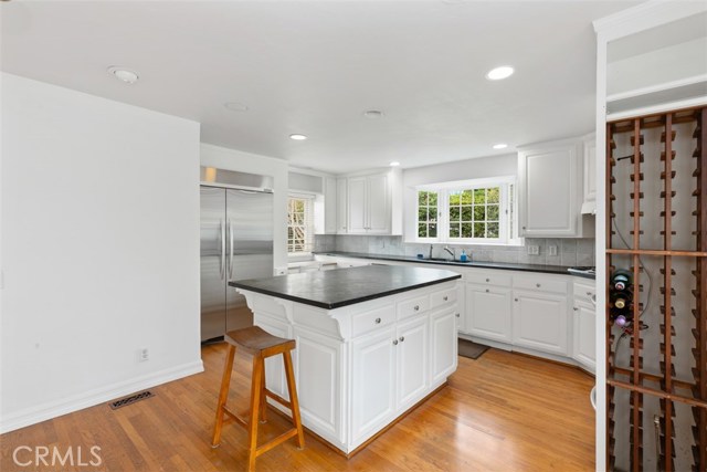 GRANITE COUNTERS, STAINLESS STEEL APPLIANCES, AND WINE RACK