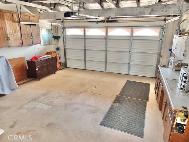 Two car garage with a driveway for two additional cars