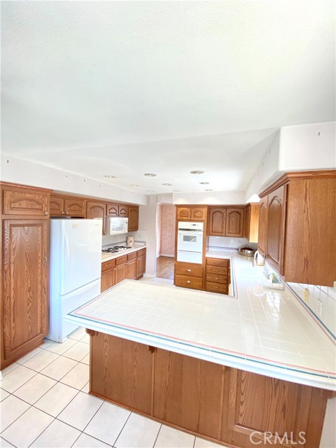It is a massive sized kitchen, with room at the overhang to watch the young one's doing homework while preparing meals.