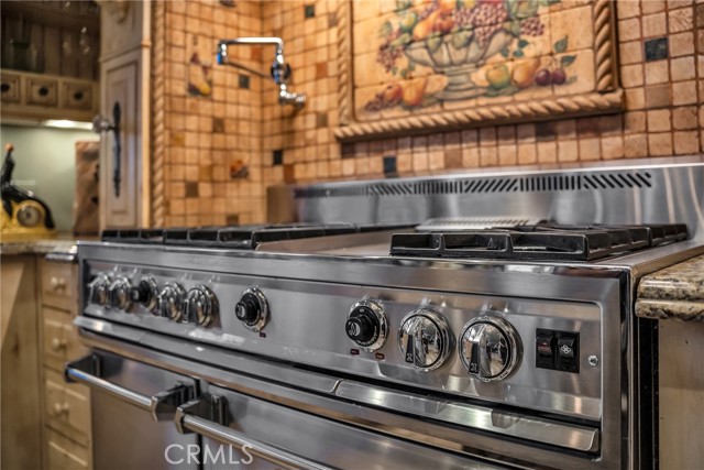 6 burner, triple oven professional oven includes griddle.