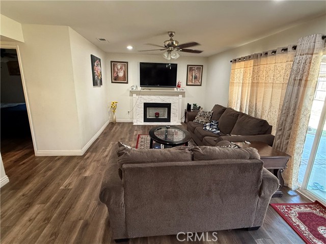 Family room with fireplace slider to backyard