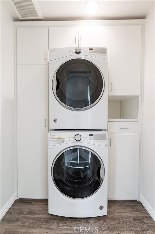 New stackable washer /dryer in separate closet w/ additional storage space