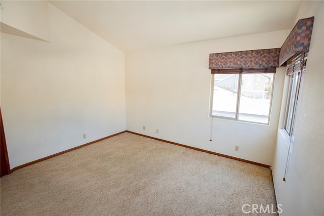 Bedroom #2: Vaulted ceiling, mirror closet doors