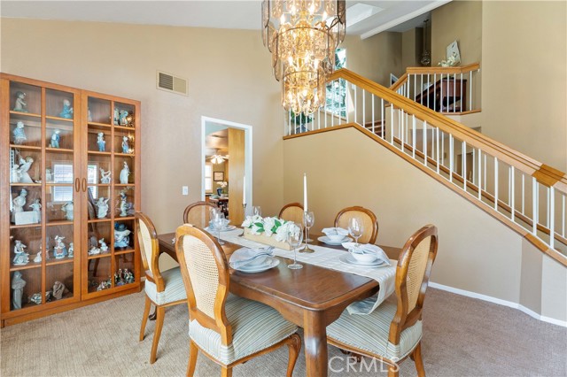 Formal entry has space for bench to take shoes off. Herringbone pattern wood flooring adds character. Stairway has skylight, with mirrored display shelves and a nook to place what you want like a chair or desk or curio cabinet, etc.