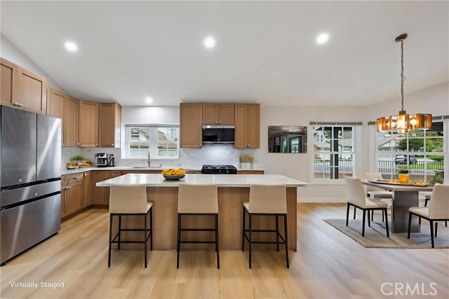 New custom kitchen with beautiful cabinets and gold vein marble look quartz counter tops.