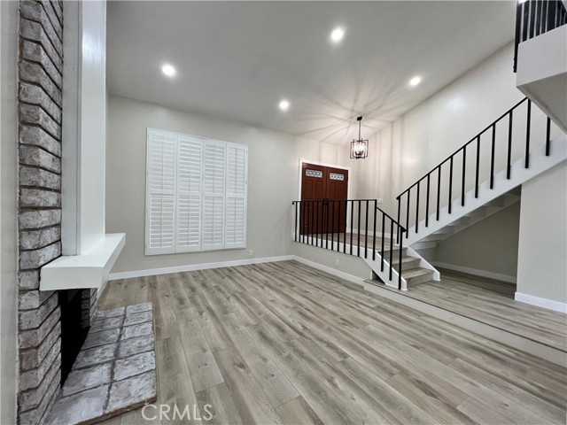 Open and airy living room featuring plantation shutter