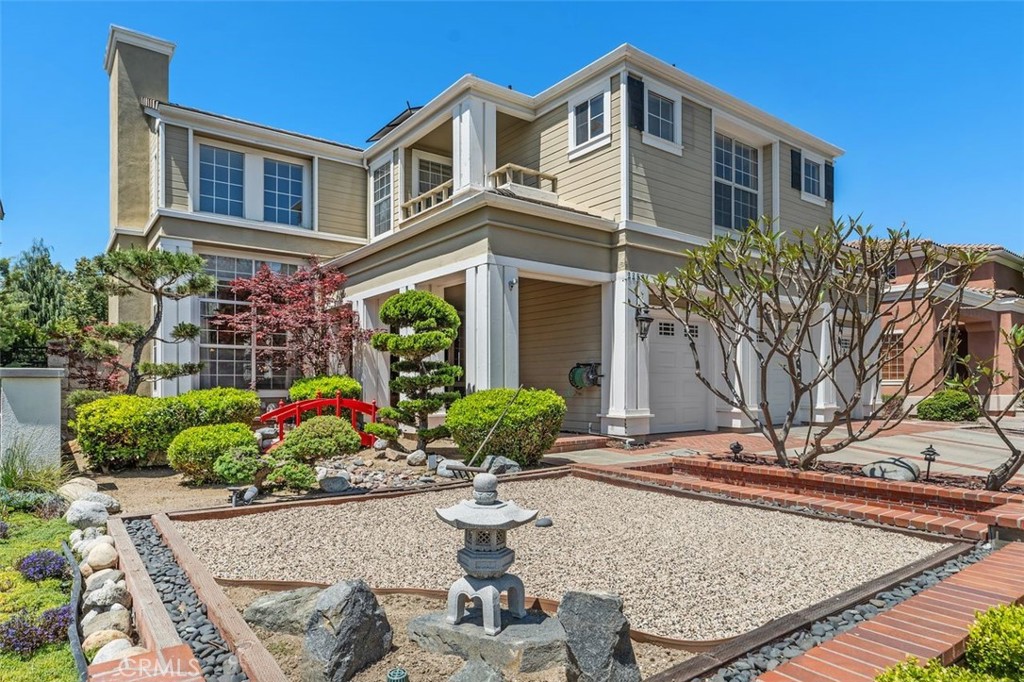 Welcome to 22581 Summerfield, an elegant gem nestled in the heart of Canyon Crest Estates—Mission Viejo’s premier guard-gated luxury community. Spanning over 3,700 square feet, this is the largest floor plan in the sought-after Belcrest tract, known for its distinctive architecture and rare availability.
A peaceful Zen garden welcomes you, setting the tone for the warmth and serenity this exceptional home offers. Inside, soaring cathedral ceilings and abundant natural light create a grand yet inviting atmosphere, complemented by high-end upgrades throughout.

The expansive layout features 6 bedrooms and 4 full bathrooms, including a luxurious primary suite and a secondary ensuite bedroom—perfect for guests or multigenerational living. A downstairs bedroom with a full bath provides flexible space for an office, den, or additional guest accommodations.
The gourmet kitchen has been beautifully reimagined with a massive center island, ideal for casual meals or large gatherings. A full suite of premium Thermador appliances—including a 60” refrigerator, dual convection ovens, 6-burner range, designer hood, and dishwasher—caters to the home chef. Rich mahogany soft-close cabinetry, granite and quartz countertops, and a custom tile backsplash complete the sophisticated look. A dry bar with built-in under-counter fridge is perfect for wine, coffee, or both.

Throughout the home, luxurious ¾” teak hardwood flooring adds warmth and continuity to the design.
Modern upgrades include 32 owned, self-cleaning solar panels, a newer 4-zone HVAC system with updated ductwork, tankless water heater, central vacuum, an "aireconomizer" energy-saving attic fan, and more.

Step outside to your resort-style backyard, redesigned for both luxury and low maintenance. Enjoy the remodeled saltwater pebble tec pool and spa, accented by dual waterfalls, elegant paver hardscaping, and drought-tolerant native plantings.

As a resident of Canyon Crest, enjoy exclusive amenities including a clubhouse, 3 pools and spa, fitness center, 4 tennis courts, pickleball, playground, sport courts, BBQ area, and year-round community events. You'll also have Lake Mission Viejo privileges—from boating and beaches to concerts and watersports.

Welcome home to comfort, luxury, and the best of Mission Viejo living.