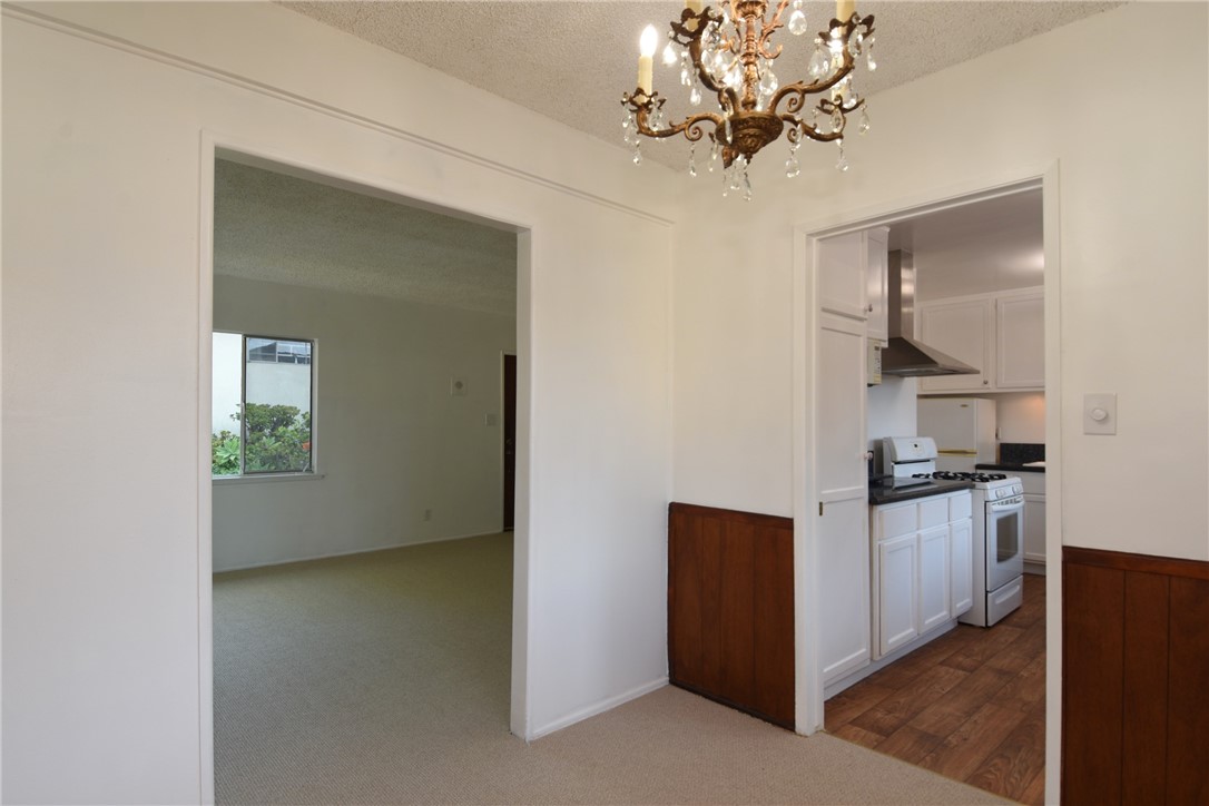 View into the kitchen and living room from the dining room.