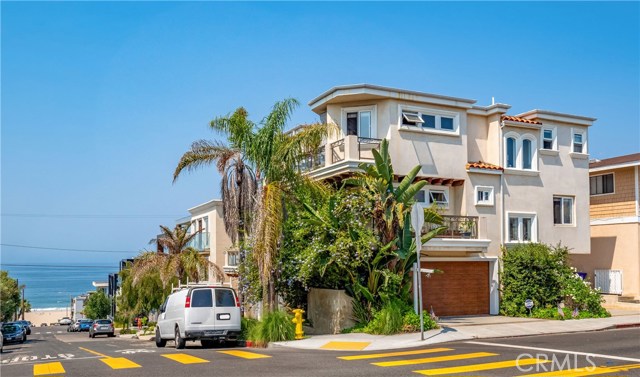 101 Highland Avenue Manhattan Beach, California THE COAST IS CLEAR! Sitting on a prominent corner lot in the South End of Manhattan Beach with a short stroll to the sparkling stretches of the sandy beach! Spanning three levels, this townhome features 4 bedrooms and 3 1/2 bathrooms. Entering the home, there is a private ensuite with a 3/4 bath and separate entrance perfect for a home office or guests. The second level accommodates three generously sized bedrooms including the master suite with a walk-in closet and a deck wrapped around the south and east side of the home with ocean views! Occupying the entire top floor and basking in south-westerly light is the open concept living room, kitchen, dining, and guest bath. Soak up the captivating ocean and Catalina views or delight in an ocean sunset over cocktails from the deck off the living room. An entertainer's kitchen with maple cabinetry, stainless appliances, pantry, and a center island with a built-in wine refrigerator that allows the kitchen to remain central to the living space. Close to all the action of the beach (two blocks) and a short distance to downtown Manhattan Beach (home to amazing locally-owned, boutiques, specialty retailers & restaurants) for that fine dining and shopping experience! This home provides all the elements for a relaxing, comfortable, and stylish easy-care living at its best.