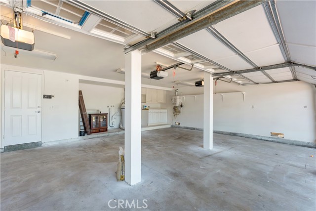 3 car garage, laundry area and tankless water heater.