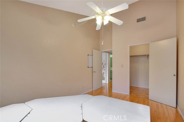 Entry To Bedroom #1.  Door To Right Leads To Large Walk-in Closet.  Overhead Ceiling Fan For Cooling Breeze!