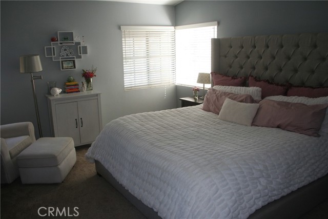 Primary bedroom with lots of light. A King sized bed fits easily into the bedroom.