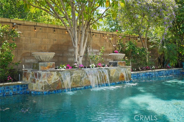 Pool has a fountain and two fire pits and lights for outdoor parties!