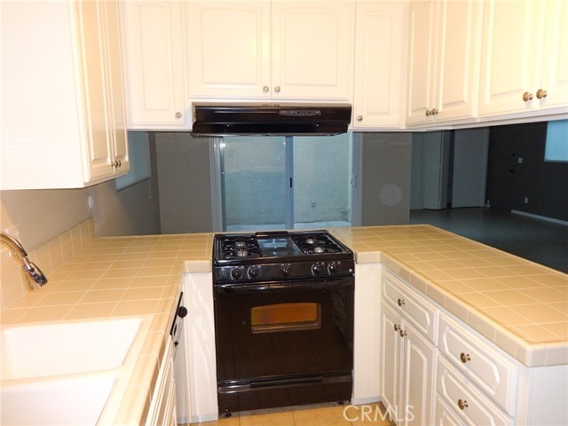 Another view of the kitchen showing the pass through counters leading to the dining area and family room.