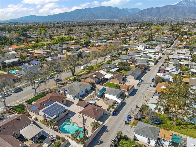 Arial shot of the neighborhood. Listing is the one with all the solar panels and sparkling blue pool.