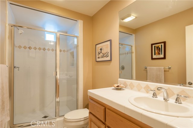 This cheerful full bath serves the lower-level fourth bedroom/family room.  Could be a terrific guest area or in-home gym/office.