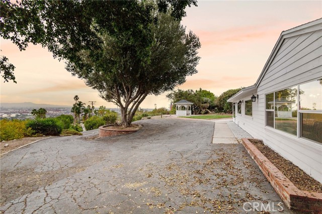 The circular driveway can hold several cars at once.