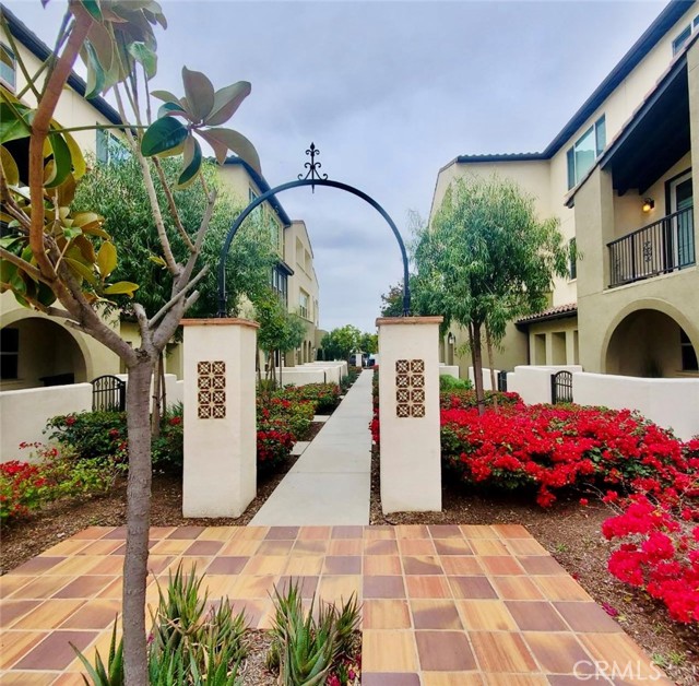 Welcome to this contemporary tri-level townhome located in the gated community of Tapestry Walk in the city of Anaheim! The first level has a bedroom and a full bath, plus extra closet space in the hall. The hall provides direct access to a two-car side by side garage. Enjoy the luxury vinyl floors throughout the home, as well as plush carpet on the stairs. Walk up to the second floor where you will appreciate an open concept living space. The kitchen features an expansive island with beautiful white quartz countertops, a modern backsplash, modern cabinetry, deep stainless-steel sink, stainless steel appliances, upgraded dishwasher, and recessed lighting. There are ceiling speakers in the dining and living room to play music throughout the second floor. There is also a guest bathroom and small closet space on this floor. On the third floor, you will find two additional bedrooms and the laundry room. The master suite has a bathroom with a white marble tile shower, a dual sink vanity and walk in closet. Down the hall is a second bedroom with en-suite bathroom. The laundry room in the hallway is equipped with built in upper cabinetry. This condo is also ADA friendly. The community amenities include a gated entrance, firepit gathering area, dog park, pool, electric vehicle charging station, bocce ball court, and BBQ area. Make your home in the heart of Anaheim, just minutes from Disneyland Resort, Old Towne Orange, The Outlets of Orange, UCI Med Center, Angel’s Stadium, Honda Center and Artic Train Station. Easy Access to the 5/22/55/57 Freeways. Don’t miss this opportunity! We look forward to seeing you soon!