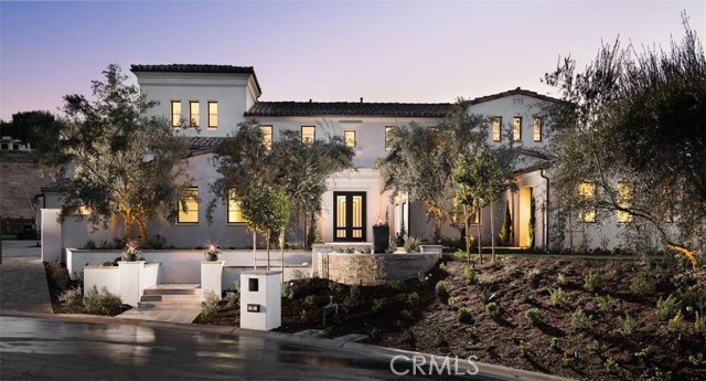 22 Tree Fern Irvine, California BRAND NEW ESTATE HOME! Experience the finest in luxury living in the newly completed Estate on a quiet cul-de-sac on the hillside of Orange County's prestigious Shady Canyon community. Behind the gates, drive along winding roads with natural rugged surroundings before arriving at your NEW Santa Barbara-style 9,158 sf estate, nestled on an expansive 28,088 sf lot. The inviting open floor plan, with 14 foot high ceilings and oversize windows, sliding pocket doors, and custom french doors, provides spectacular canyon views out toward Newport Beach. Upon entry, one is struck by the contemporary, clean interior style. The floor plan gracefully compliments an expansive yard with a luxury pool and spa. Family and guests will enjoy 6 spacious bedrooms, 7.5 baths, a 6-car garage, Private Office, Gym, Home Theater, Tower Loft, large Great Room and adjoining Dining Room. The large Gourmet Kitchen, with back kitchen, and Family Room connect to 2 adjoining California Rooms. A ground-level junior master suite boasts large double-doors opening directly to the pool deck. The Master Suite includes a private covered deck with contemporary fireplace, master bath, and large walk-in closets. White Oak floors, Custom Granite Counters and Cabinets, Designer Appliances and Fixtures, prewiring for SMART home technology are just a few of the custom features. 24 hour security and gated. Only minutes from the beach, Tom Fazio-designed golf course, airport, freeways, and world-class shopping and dining.