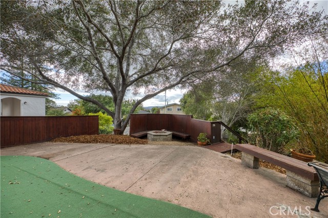 Front yard and patio area with putting green