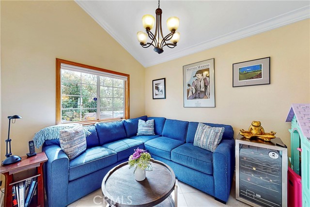 Formal Dining area next to kitchen. Seller opt to put a sofa there