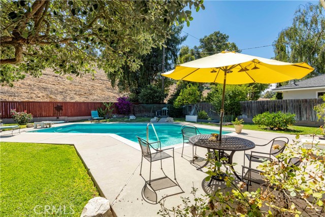 Fenced in HUGE backyard with lawn, pool and deck