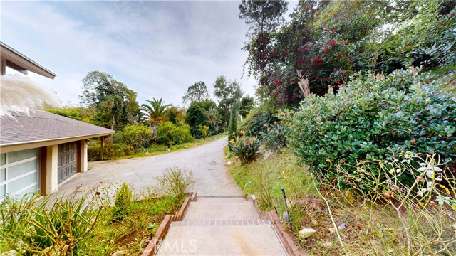 Lush grounds leading to front door