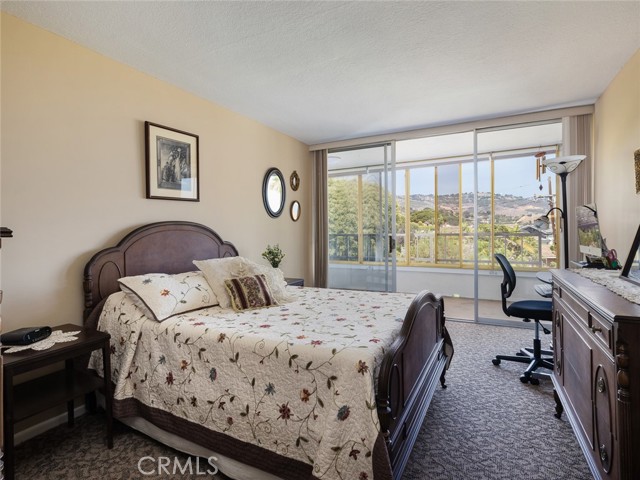 Good sized second bedroom has access to ocean view balcony