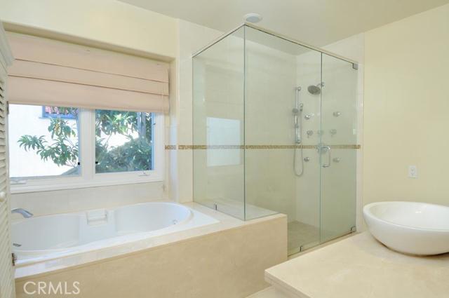 Master bathroom has spa tub and large shower