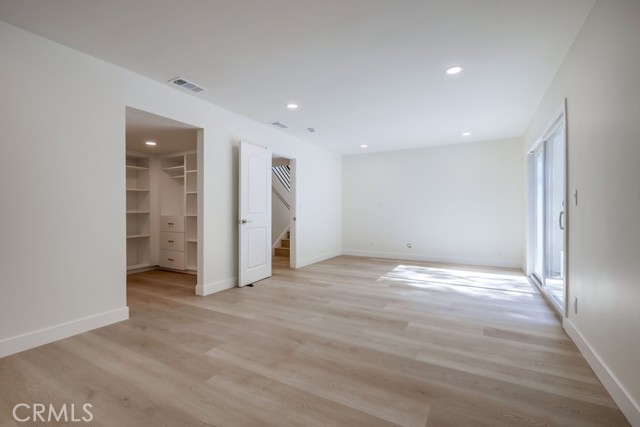 Downstairs Bonus Room with Custom Walk in Closet and Private Bathroom.