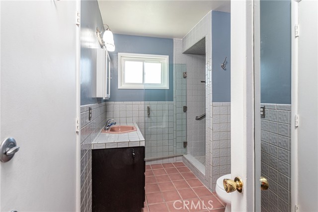 Primary bathroom #2, new glass shower door.