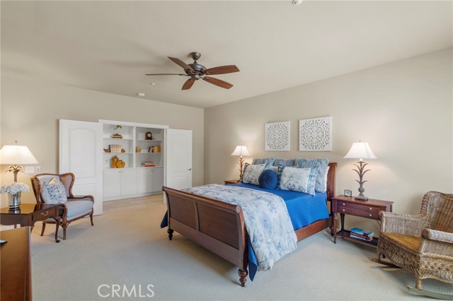 Large primary suite bedroom with double door entry