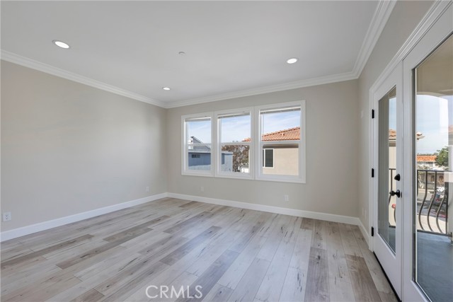 Primary bedroom has recessed lights.