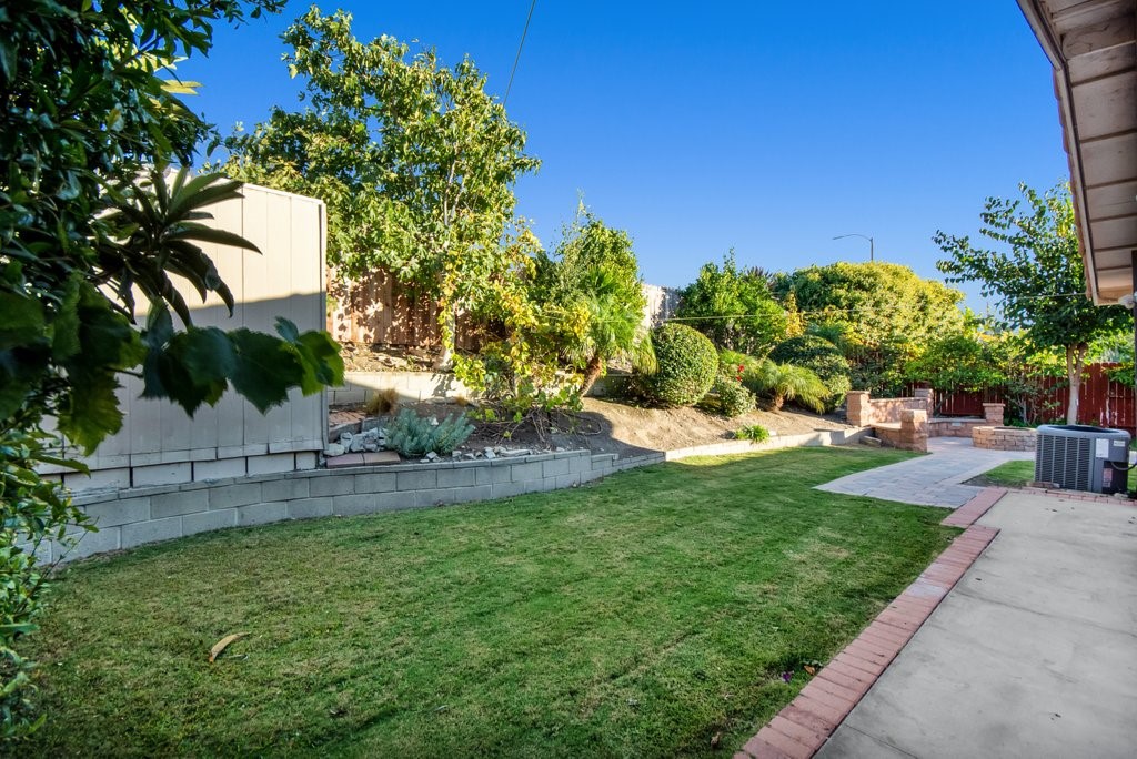 Backyard showing AC unit and Open Dire Pit