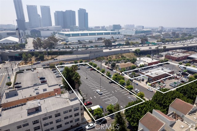 Attractive investment opportunity in a prime location directly off of the 110 Freeway. The property portfolio comprises several lots situated in downtown Los Angeles, strategically positioned near the Convention Center, LA Live and Crypto Arena. The lots offer a combined land area of 68,707 square feet (1.57 acres) and are zoned CM-1-O - Commercial Manufacturing. The properties boast excellent accessibility to major transportation routes, public amenities, and business hubs, making them highly desirable for parking, commercial development, mixed-use projects and affordable housing projects (ED1 eligible by right). 
Downtown Los Angeles has experienced significant growth and revitalization in recent years, becoming a vibrant hub for commerce, entertainment, and residential development. The area benefits from a thriving Convention Center, Crypto Arena and LA Live hosting numerous high-profile events and attracting a steady stream of visitors. The proximity of the lots to these venues further enhances their appeal for potential buyers, presenting a unique opportunity to capitalize on the growing demand for parking, commercial, hospitality and housing space in the vicinity.
The property is asphalt paved and fenced and utilized as surface parking lots, serving the surrounding Downtown Office and Commercial district; including the Staples Center and LA Live Sports and Entertainment Venues. The subject is located in the Enterprise Zone and Transit Priority Overlay Zones. Offering consists of the following parcels -5137022017, 5137023001, 5137023003, 5137023007, 5137023008, 5137023009