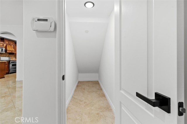 extra storage in the living room under the stairs