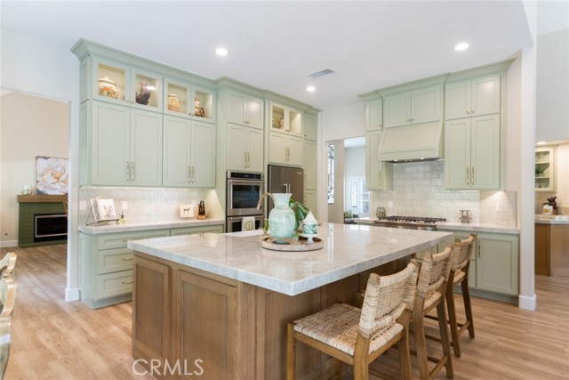 This kitchen is a jaw dropper! Custom cabinetry the extends all the way to the ceilings with soft close draws and doors, designer style hardware, inside and under cabinet lighting.