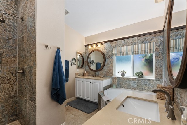 Dual sinks feature along with unique tile throughout