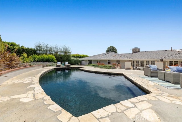 Remodeled Pool with Pebble surface and stone tile, heated by Solar Heating that keeps the pool at approximately 85 degrees year around.