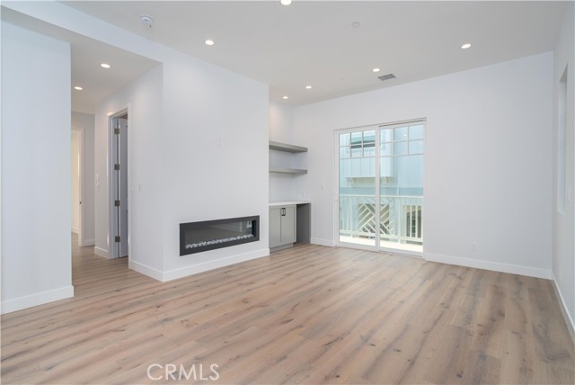 Primary Bedroom with fireplace and Balcony