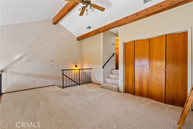 Taking steps up to the loft you are impressed by the openness and grandeur of this condominium. The clerestory windows allow you to easily take in natural light with the privacy they allow.