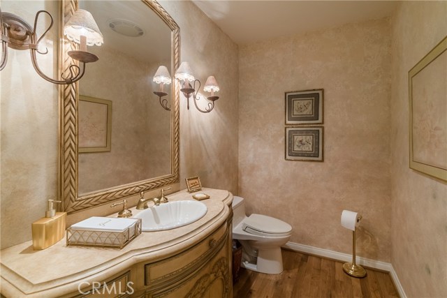 The formal guest bathroom is convenient to the living room and family room.