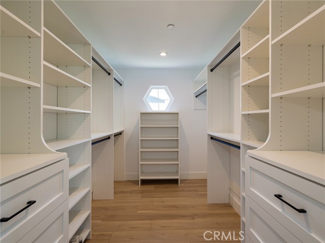 spacious customized walk in closet in primary suite