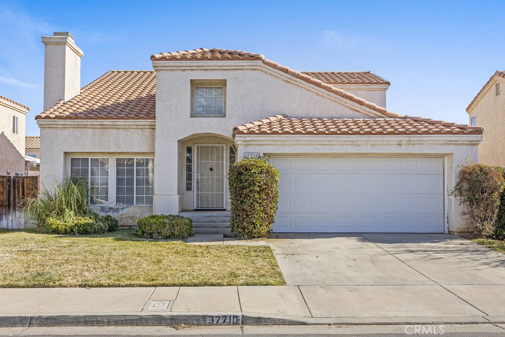 Lovely 4 bedroom home in a gated community. Located in East Palmdale with low HOA's.  You’ll enjoy the open floor plan in your living room with a beautiful brick fireplace, which is open to the dining area.  The kitchen has been freshly painted and offers wood cabinets, white tile counters, and is adjacent to the family room so it feels connected as the heart of the home.  There is a bedroom and full bathroom conveniently located on the main floor.  Upstairs you’ll find 3 additional bedrooms.  The primary bedroom offers you a spacious en-suite retreat, with plenty of closet space and natural light. The hallway has extra built-in storage perfect for towels, sheets, and linens. This home has a solar lease through Sunrun, a 2 car attached garage and the backyard is the perfect blank slate!